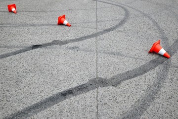 tire marks on the asphalt and posts a warning