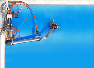 Air piston compressors. Filter for compressor with pressure gauge and pressure regulator, lubricator, air valve on a blue background. Electric pneumatic valves