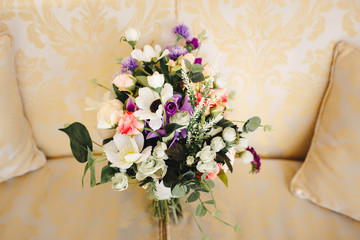 Wedding bouquet lying on the couch