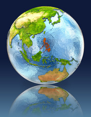 Philippines on globe with reflection