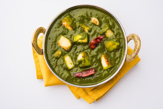 Indian curry dish - Palak paneer made up of  spinach and cottage cheese, served in ceramic bowl, selective focus