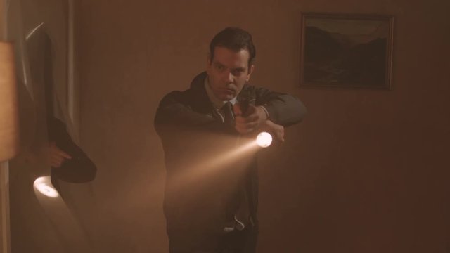  Police detectives with handguns & flashlights raiding dark apartment