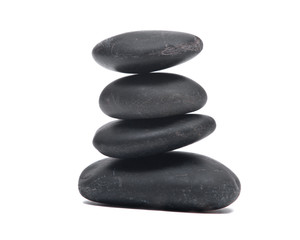 Super polished black river pebbles isolated on white background