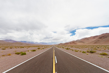 Road with mountain in a desert valley in Catamarca, Argentina
