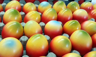 Colorful easter eggs in carton