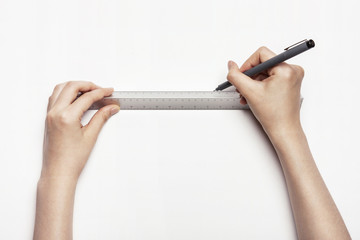 woman(female) hand hold a ruler isolated white.