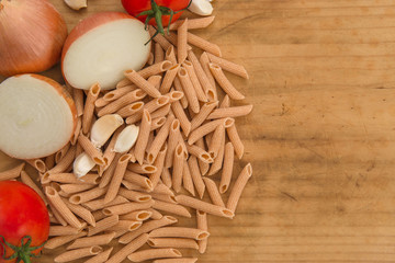 Italian pasta recipe ingredients on chopping board background