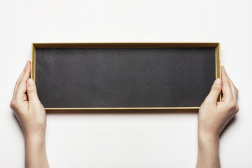 woman(female) hand hold a black empty box for gift isolated white.