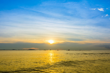 Boat and beach with sunset background