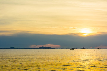 Boat and beach with sunset background