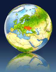 Ukraine on globe with reflection