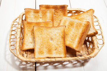 Toast bread on a white wooden background