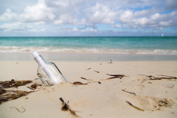Fototapeta na wymiar Message in a Bottle on Beach