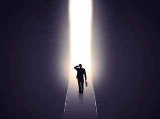 man looking at opened concrete wall