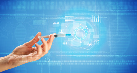 Female doctor holding syringe