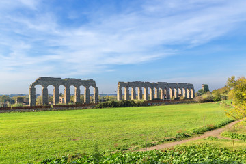 Fototapeta na wymiar Rome, Italy. Scenic landscape with the ruins of an ancient aqueduct