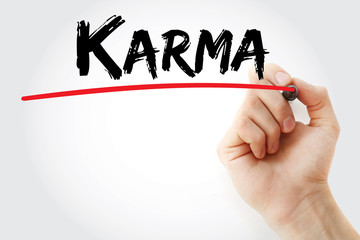 Hand writing Karma with marker, concept background