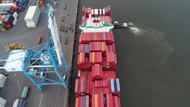 Aerial View Tugboat Parking a Container Ship in Philadelphia Port