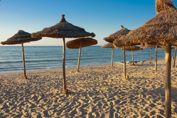 straw umbrellas on the beach