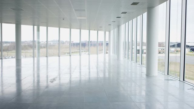 Interior view of large empty modern property with panoramic view. No people. 