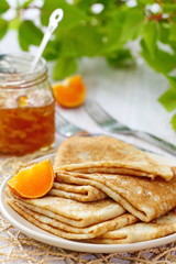 Pancakes with orange jam and fruit