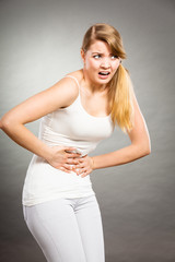 Woman suffer from belly pain.