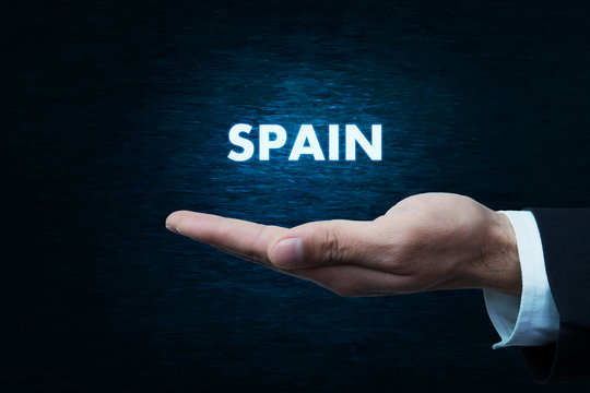 Hand holding Spain word