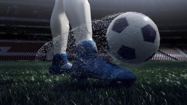 close up view of soccer ball and player leg. shooting to the goal in slow motion