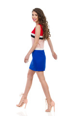 Walking Smiling Woman In Mini Dress And High Heels