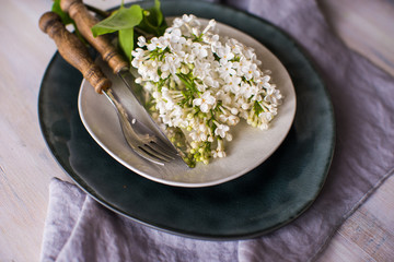 Spring table setting with white lilac