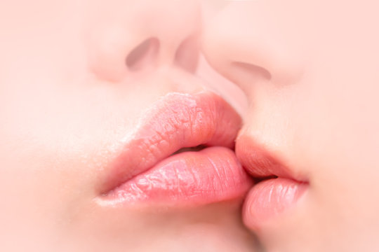 Lesbian sexy tenderness, pair of lesbian lips close together. Female love and friendship, young face. Pink pure skin of young girls