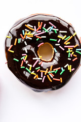 Lush donuts with chocolate icing and bright sprinkles