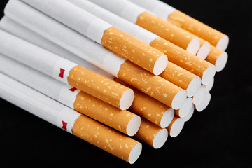 cigarette close up isolated on blak background. Drug addiction. Tobacco smoking. cancer. Nicotine. Bad habit.