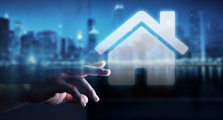 Businessman touching 3D rendering icon house with his finger