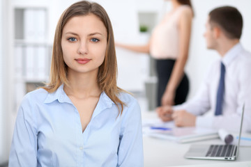 Portrait of a young business woman  at meeting.