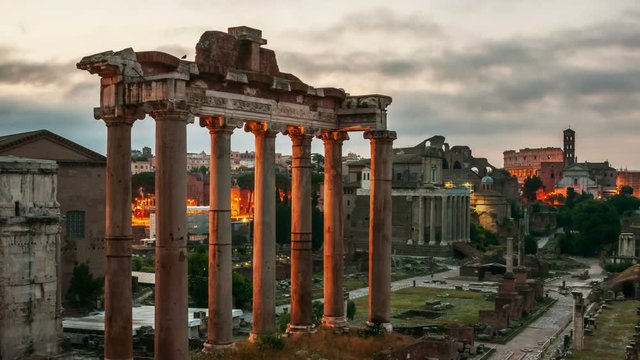 Rome, Italy. Aerial view of Roman forum in Rome, Italy in the morning. Time-lapse of a popular landmark at sunrise. Cloudy sky with moon