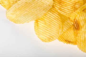 Crispy potato chips. Fast Food. Potatoes. Fatty unhealthy foods. corrugated chips