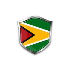 The national flag of Guyana. Metal shield with reflections on a white background.