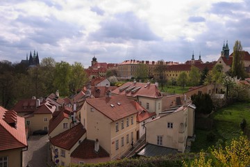 Fototapeta na wymiar Prague old town. Landscape picture of pictouresque small quater called Novy svet just by the prague castle in capitol of Czech republic Prague. Picture taken in spring time, sunny day but with clouds.
