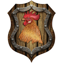 round wooden shield with the head of a cock