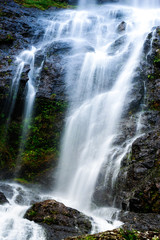 Fototapeta na wymiar Mountain waterfall with long exposure