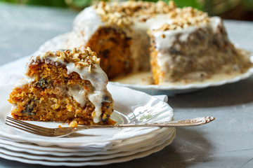 Carrot cake with walnuts, dessert in the garden, selective focus