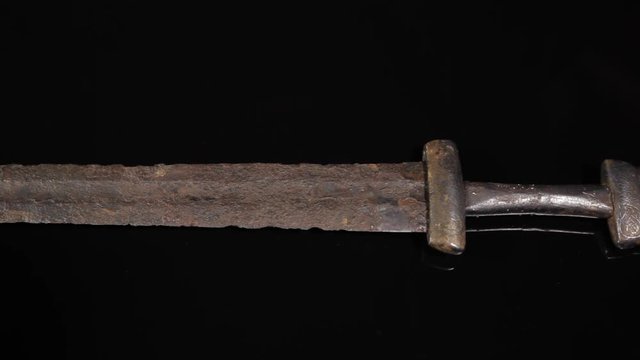 Original ancient Viking sword from 11th century. Hilt with exceptional silver engravings.