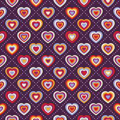 Seamless background with multicolored hearts