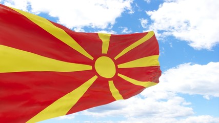 Waving flag of Macedonia on blue cloudy sky.