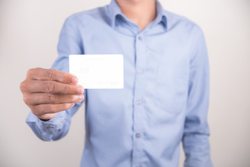 High angle view of man showing the blank bussiness card in hand