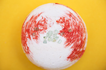 Tasty sweet macaron on yellow background. Close up.