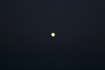 The moon in the dark night in the clear sky
