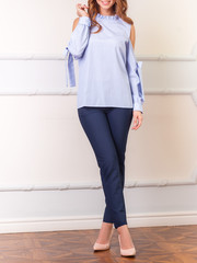 Beautiful woman in casual casual clothes posing for clothes catalog. Blue jeans, blue top