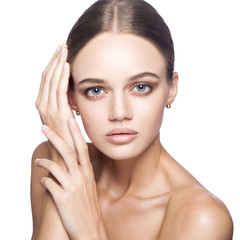 Calm beauty. Portrait of beautiful young blonde woman with nude makeup, blue eyes, hairstyle and clean face. Studio shot, Isolated on white background.